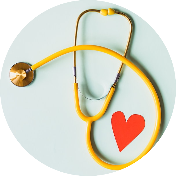 Yellow Stethoscope on Green Surface with Paper Heart
